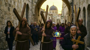 Christian pilgrims carrying wooden crosses during Holy Week procession in Jerusalem, ABN NEWS.