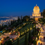 Illuminated Bahá’í Gardens and the Shrine of the Báb at night in Haifa, Israel.